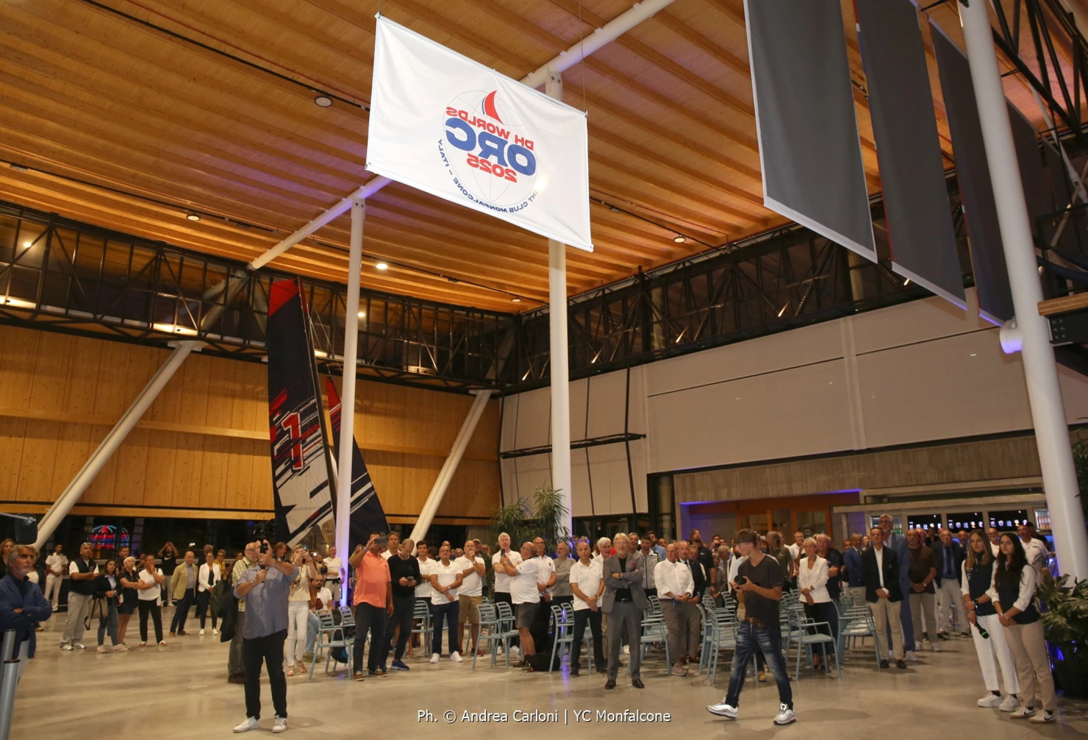 Hoisting the event flag - Opening Ceremony in Olympic Hangar