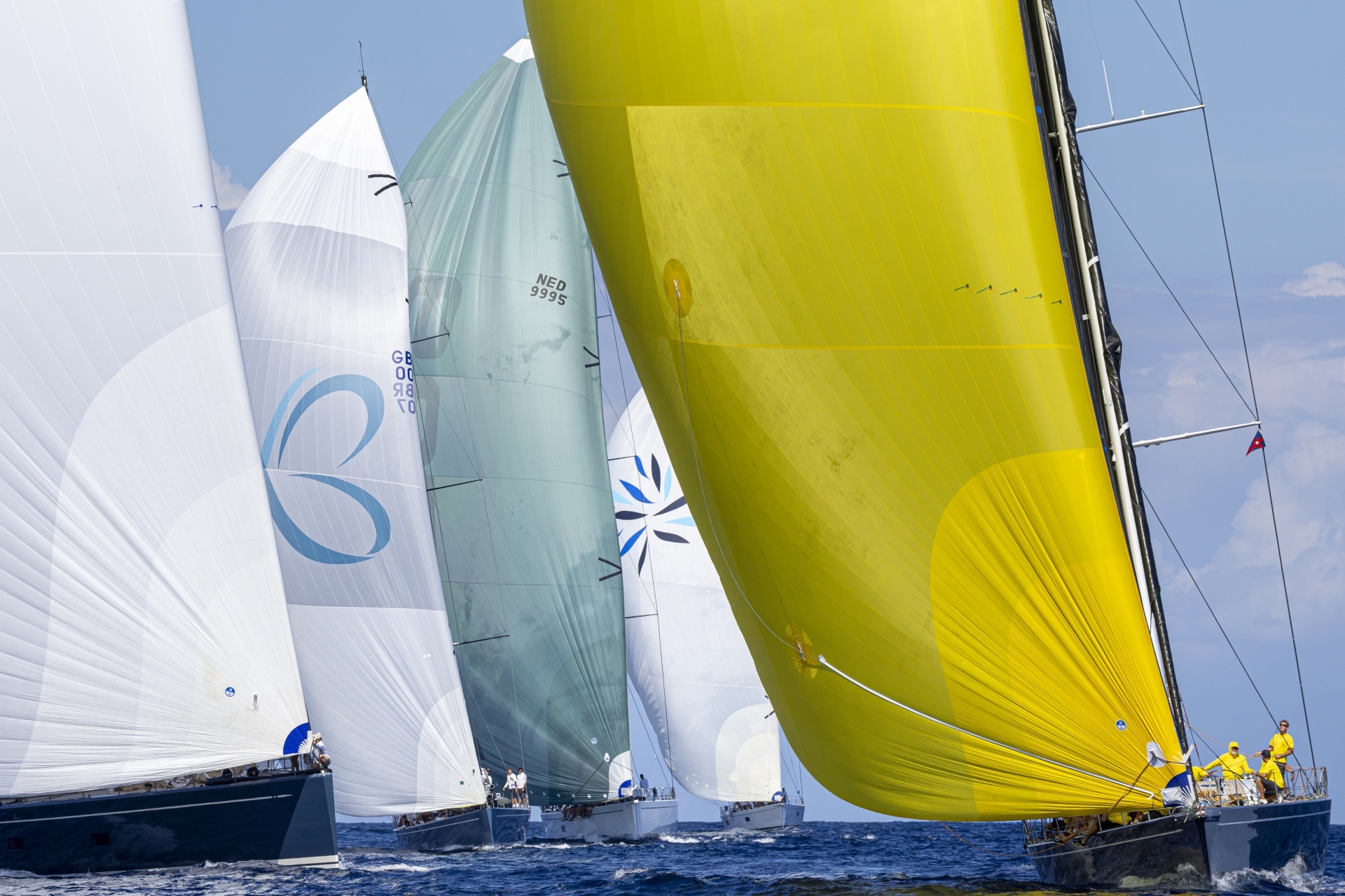 The Swan 90 Freya (right-hand side, yellow gennaker), division winner at the 2026 Rolex Swan Cup. Photo credit: Rolex/Studio Borlenghi